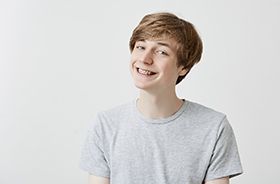 Portrait of smiling teen boy with braces on his teeth
