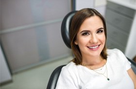 Smiling patient at appointment for root canal therapy