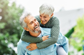 Happy senior couple, enjoying the benefits of root canal therapy