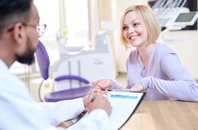 patient and dentist discussing cost of cosmetic dentistry