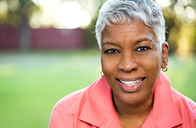 Smiling older woman outdoors