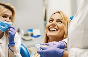 Woman talking to dental staff