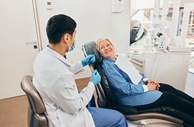Senior patient talking to her dentist
