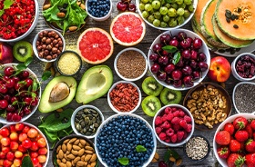 Colorful variety of healthy food laid out on countertop