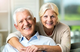 Senior couple enjoying the many benefits of implant dentures