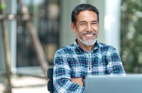 Confident man with dental implants in Woodbridge smiling