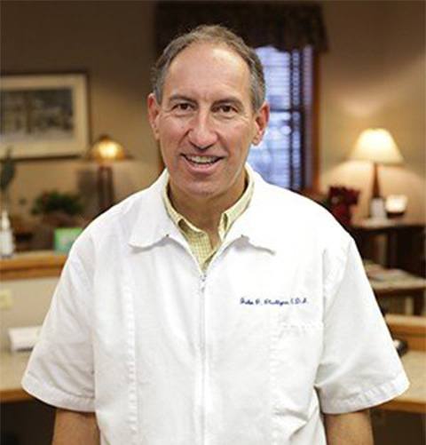Woodbridge dentist Doctor John Plachtyna smiling