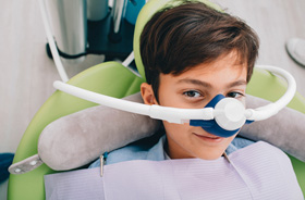 Young boy wearing nitrous oxide nasal mask