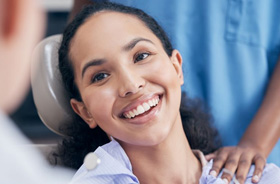 Close-up of happy patient in dental treatment chair