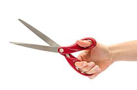 Hand holding a pair of scissors