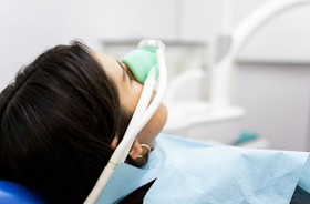 Relaxed dental patient wearing nasal mask for nitrous oxide