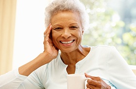 woman with hand on cheek