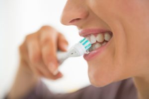 brushing teeth to keep up with dental hygiene through quarantine