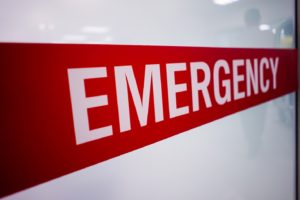 red and white emergency sign on white background