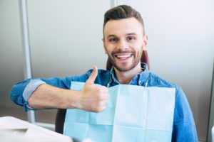 Man at dental appointment to maximize insurance benefits