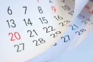 Pages of calendar to illustrate timeline for Invisalign in Woodbridge