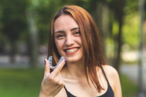 Woman enjoying the benefits of Invisalign after braces in Woodbridge