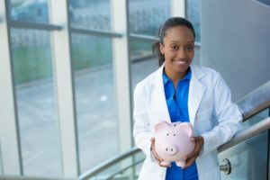 Dentist with piggy bank accepts dental insurance in Woodbridge 