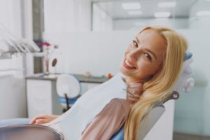 Happy dental patient at appointment for restorative treatment