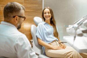 Dentist and patient talking during smile makeover consultation 